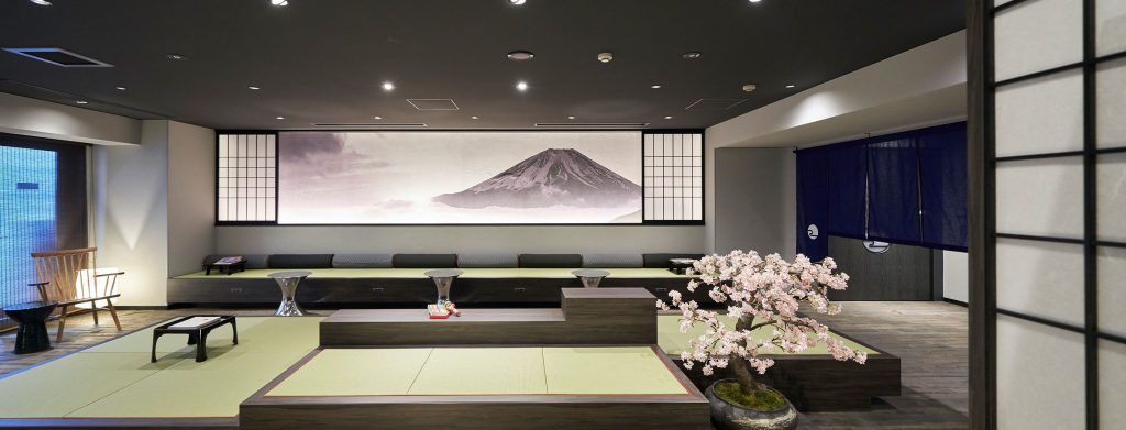 The living lobby at Resol Poshtel Tokyo Asakusa showing a seating area